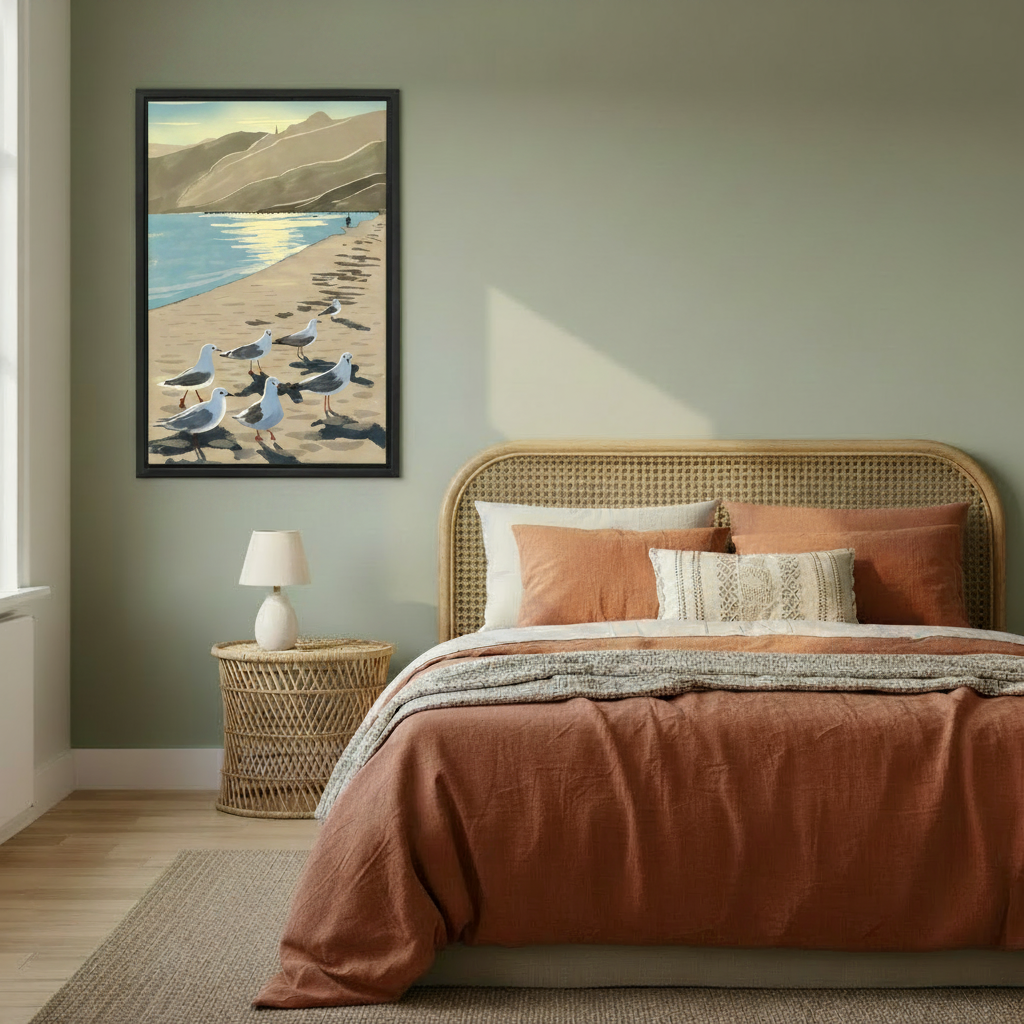 Vintage coastal seagulls beach wall art in black frame hanging in sage green bedroom with rattan headboard