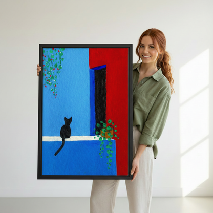 Woman holding large framed black cat Mediterranean wall art print, black frame, bold blue red color block illustration, showing actual print size