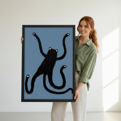 Hand holding a humorous long arm black cat framed canvas art print with blue background, funny cat lover wall decor