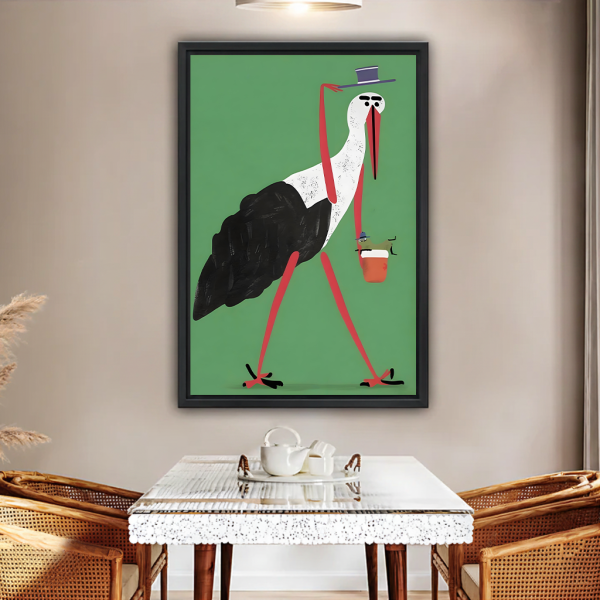 Gentleman stork with coffee framed canvas wall art, black frame, green quirky bird illustration, displayed above glass dining table with rattan chairs