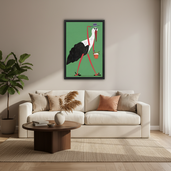 Gentleman stork with coffee framed wall art, black frame green whimsical bird illustration, living room decor above beige sofa with round coffee table