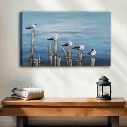 Gallery wrap canvas print of seagulls on weathered pier posts over blue water, nautical coastal living room wall art