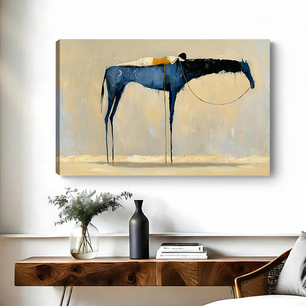 Abstract blue horse canvas art print with expressive dripping paint and gold detail on beige background, displayed above a wooden console table