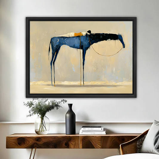 Abstract blue horse minimalist framed wall art with drip paint texture and gold accents on beige background, hung above a wooden console table