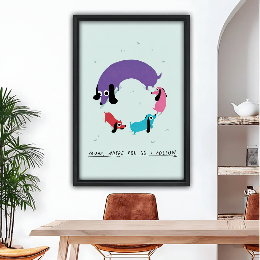 Colorful dachshund family framed canvas wall art — one large purple dachshund with three small puppies on mint green background, black frame, dining room wall decor