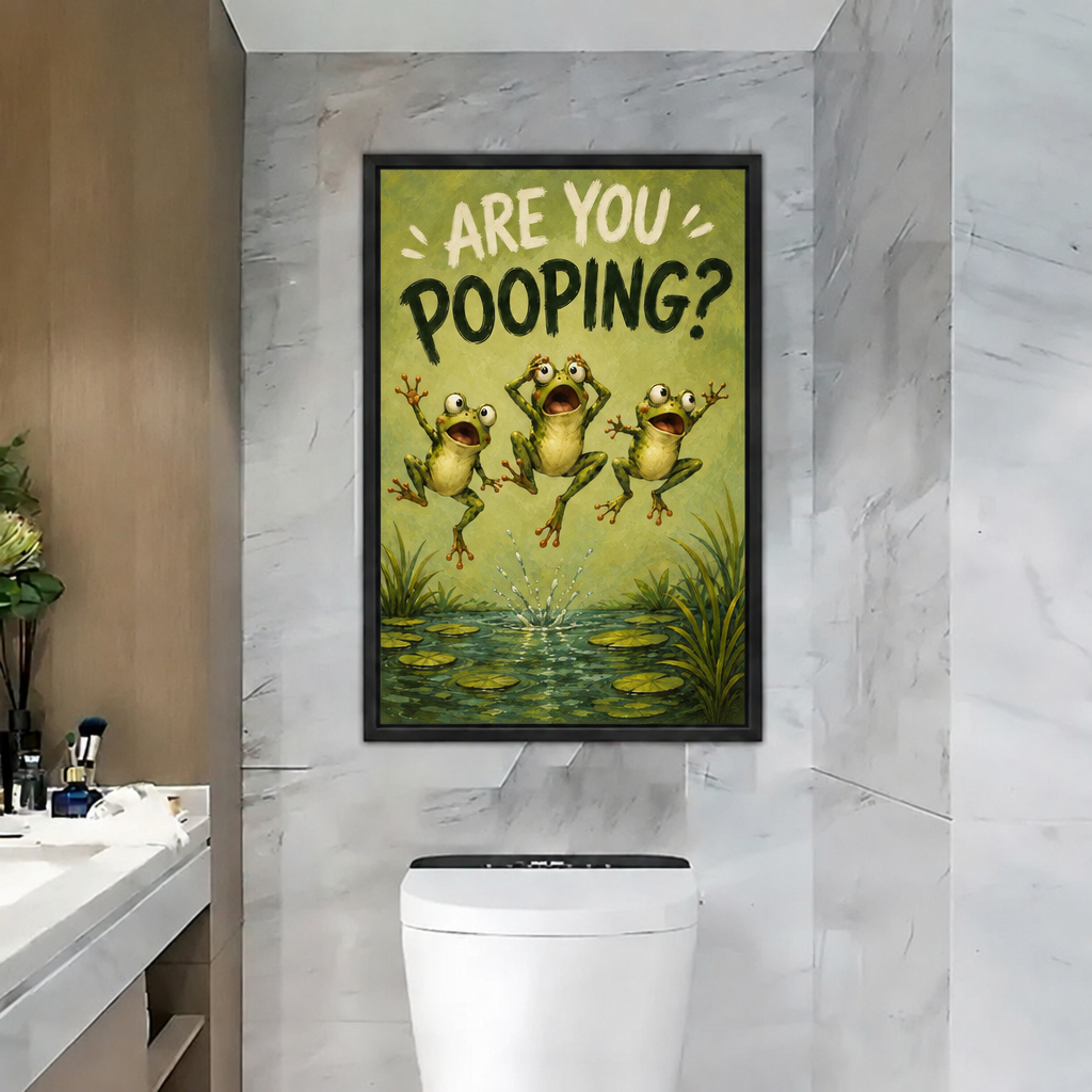 Framed are you pooping frogs canvas wall art hanging on a marble bathroom wall above the toilet.