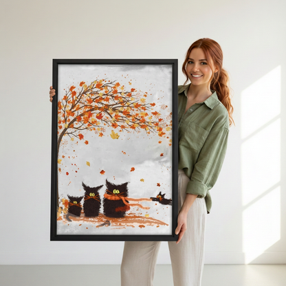 Woman holding framed autumn black cats canvas wall art.