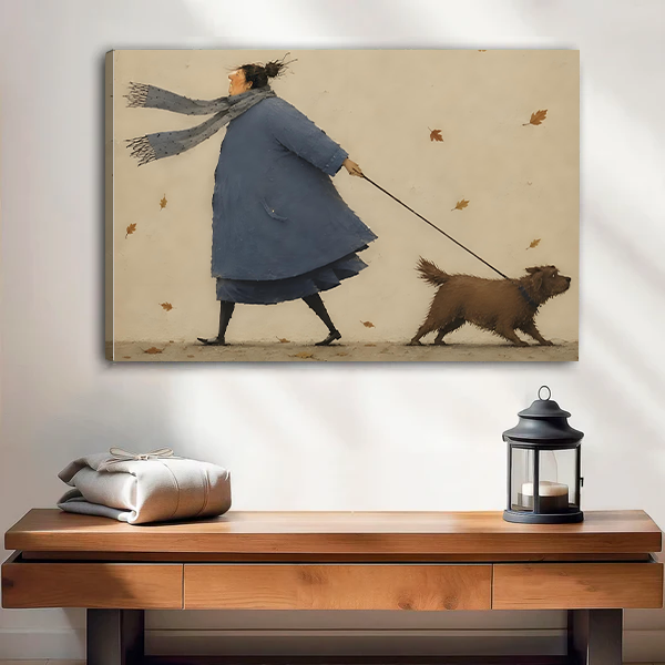 Gallery-wrap autumn dog walk canvas wall art with a windblown scarf and falling leaves hangs above a console.