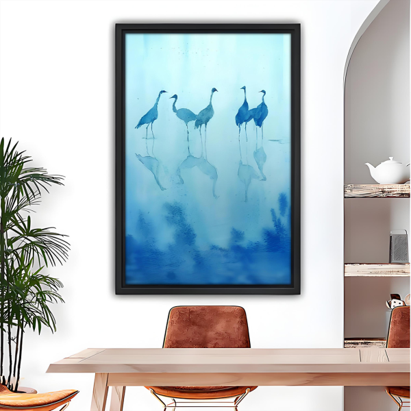 Blue crane watercolor reflection framed canvas wall art, black frame, five cranes in misty water, dining room wall decor above wooden table with leather chairs