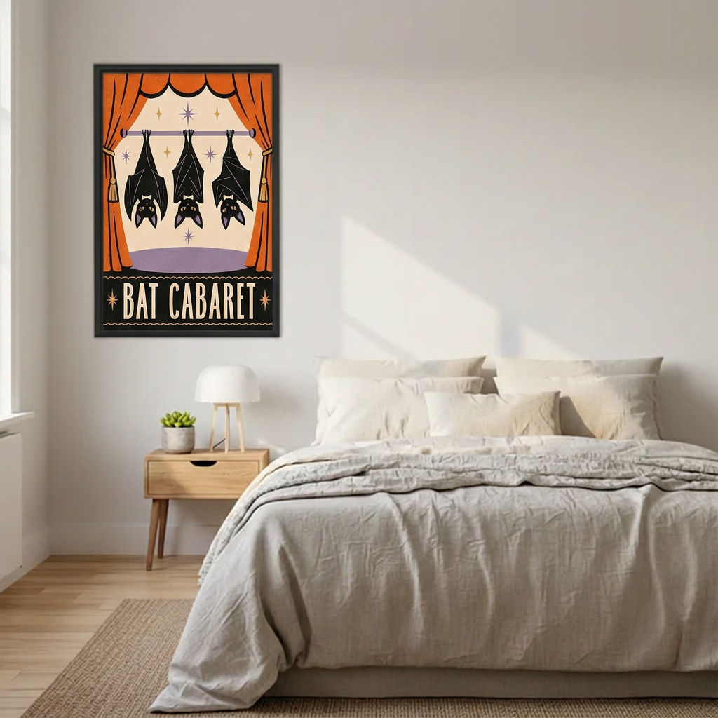 Black-framed Bat Cabaret canvas wall art beside a bed with neutral bedding and a wooden nightstand.