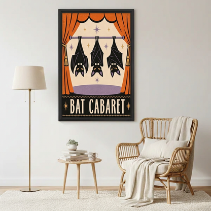 Bat Cabaret canvas wall art in a black frame beside a rattan reading chair and a floor lamp.