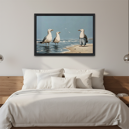Black-framed beach seagulls canvas wall art featuring a trouser-wearing gull and two shoreline birds above a cream sofa.