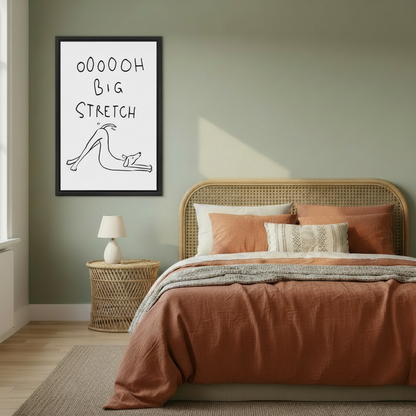 Framed funny dog big stretch wall art hung on sage green bedroom wall above rattan headboard with warm terracotta bedding