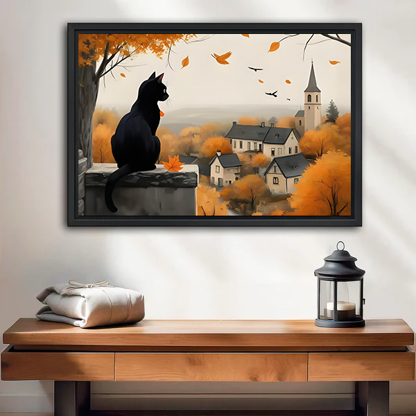 Black cat autumn village canvas wall art above a white bed, showing falling leaves, rooftops, and a church.
