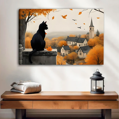 Black cat autumn village canvas wall art displayed above a wooden console beside a black lantern.