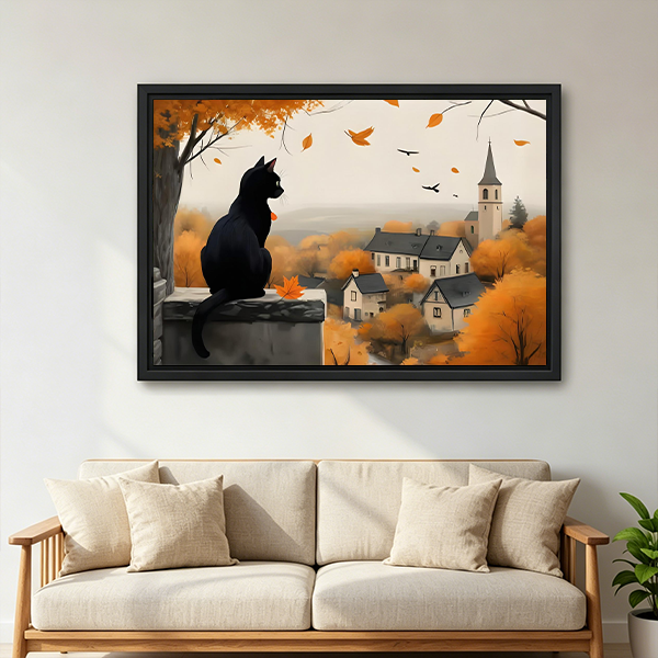 A woman holds black cat autumn village canvas wall art featuring falling leaves, rooftops, and a distant church.
