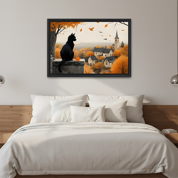 Black cat autumn village canvas wall art hangs above a wooden console beside folded linens and a lantern.