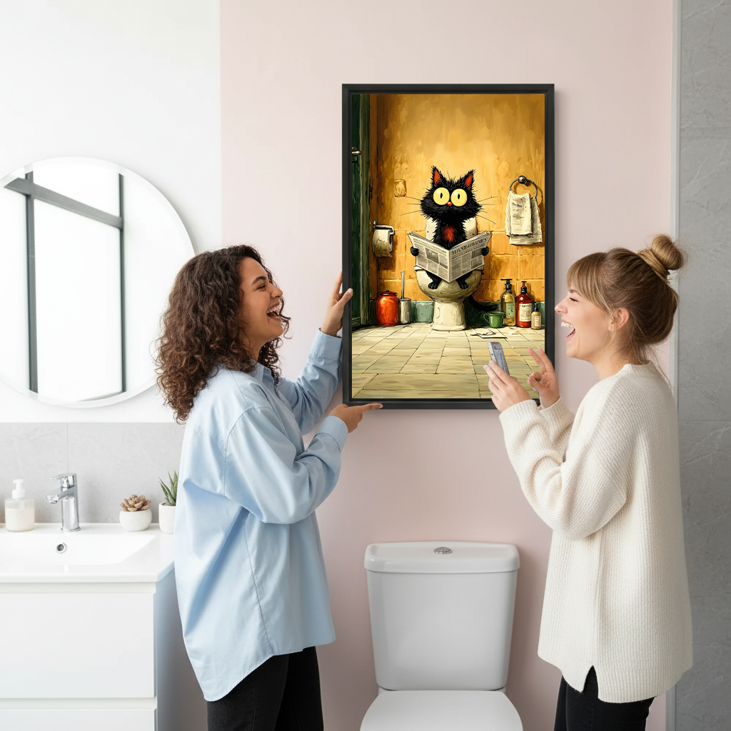 Two women laughing while hanging funny black cat on toilet framed wall art print in modern bathroom