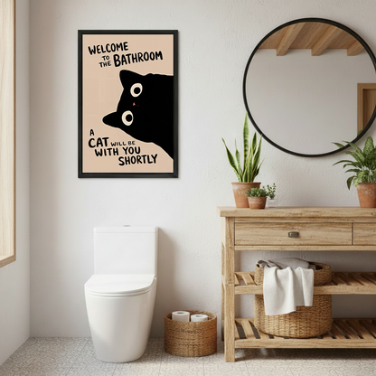 Retro black cat bathroom canvas wall art in a black frame above a colorful patchwork sofa.