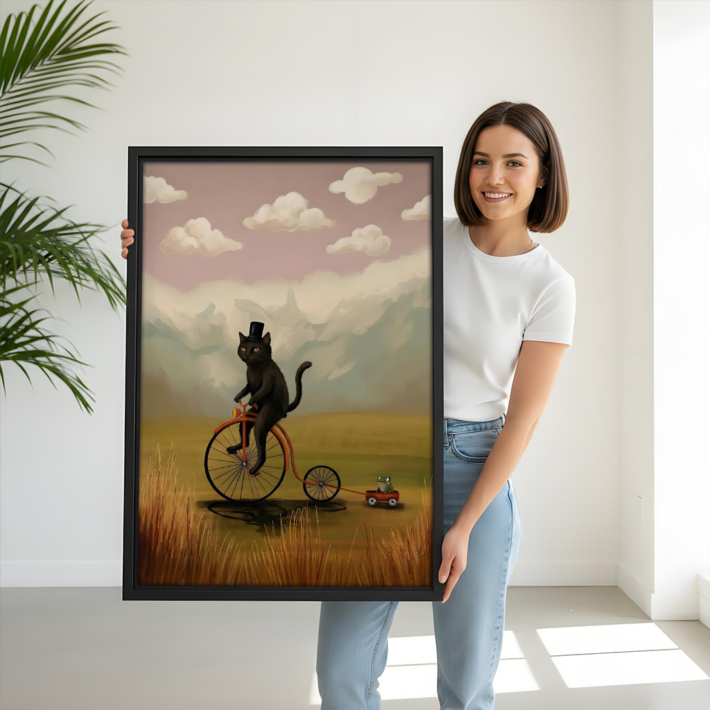 Woman holding a framed black cat bicycle wall art print for size reference