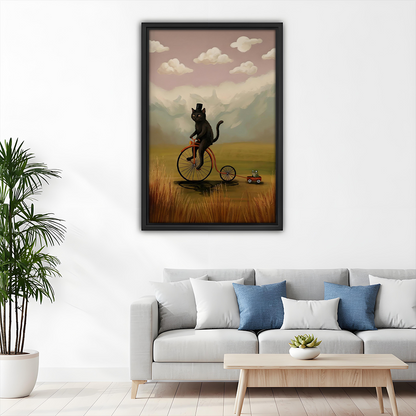 Framed black cat bicycle wall art decorating a living room above a grey sofa