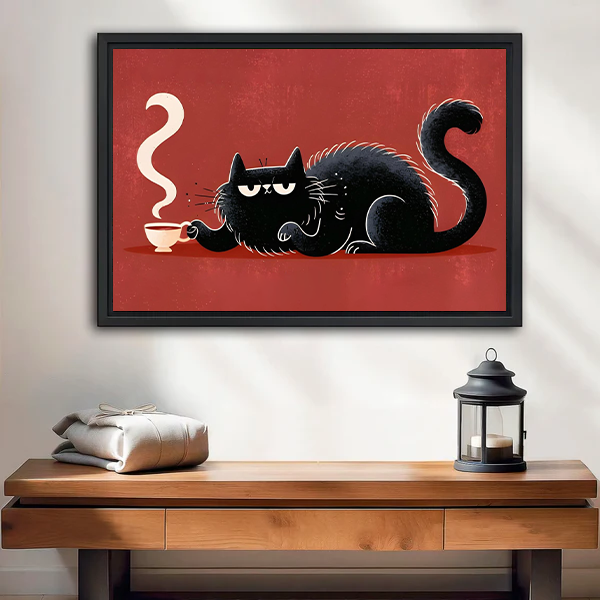 Framed black cat coffee canvas wall art with a red background displayed above a cream wooden-arm sofa.