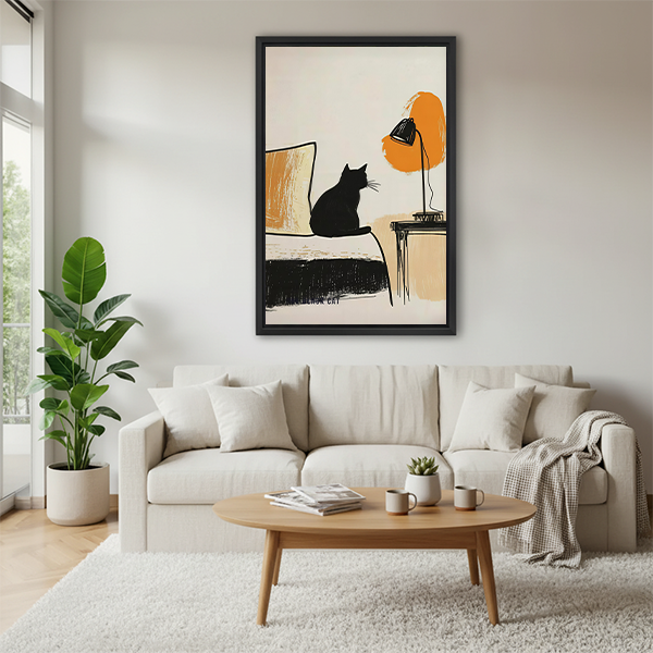Woman holding framed black cat and lamp canvas wall art featuring loose black lines and warm orange accents.
