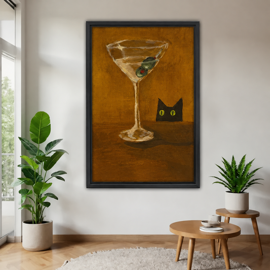  Framed black cat and martini canvas beside indoor plants.