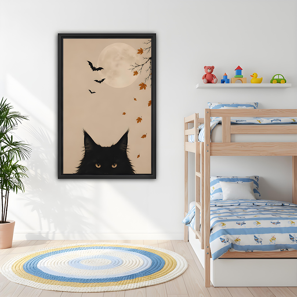 Black-framed black cat moon canvas wall art with autumn leaves hangs above a dining table.