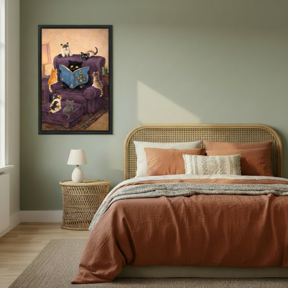 Whimsical framed illustration of a black cat holding a blue storybook with six kittens gathered around a purple velvet armchair, hung on a sage green bedroom wall above a rattan bed with terracotta bedding