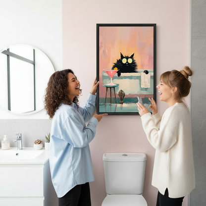 Two women smiling beside framed black cat spa canvas wall art showing cucumber eye masks and a pink cocktail.