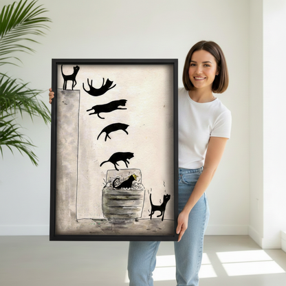 Smiling woman holding a large black-framed canvas art print of a funny sequential ink illustration of seven black cat silhouettes leaping off a ledge and plunging into a trash can with a panicked cat fleeing beside it on a cream and grey background