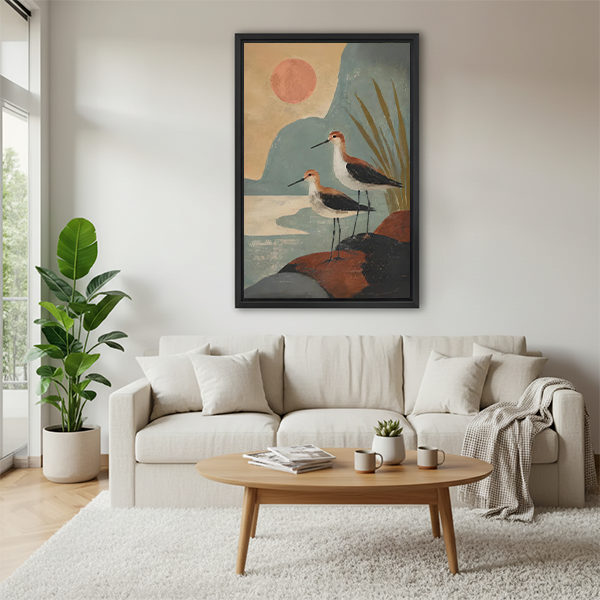 Boho shorebirds sunset canvas wall art displayed above a beige living room sofa