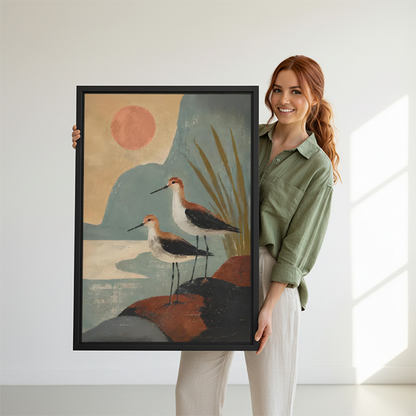  Woman holding a framed boho shorebirds sunset canvas wall art print