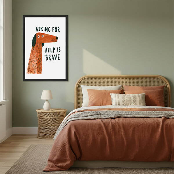 Black framed brave dog quote canvas wall art on a white background displayed above a cream living room sofa.