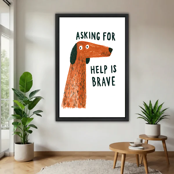 Framed brave dog quote canvas wall art with “Asking for help is brave” lettering, displayed between houseplants.