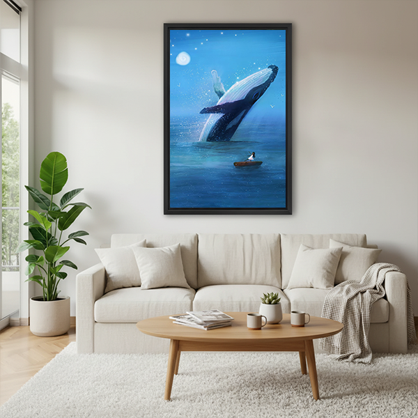 Breaching whale canvas wall art in a black frame with moon and stars, displayed between leafy plants.