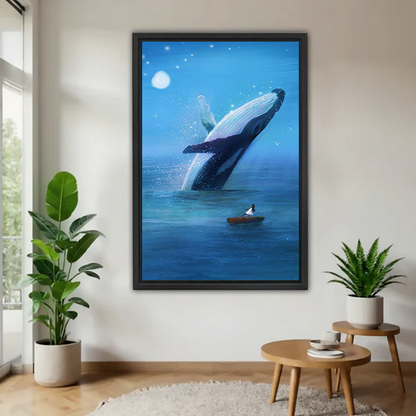 Framed breaching whale canvas wall art with a moonlit blue sea displayed above a cream sofa and wooden coffee table.