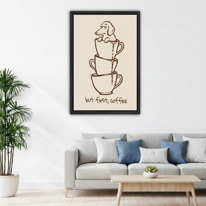 Framed minimalist dog and coffee cup wall art hung above a grey sofa in a Scandinavian living room, featuring the But First Coffee quote in hand-lettered style