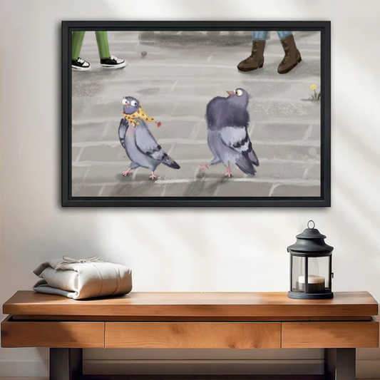 Whimsical city pigeons canvas wall art in black floating frame, two funny birds on sidewalk hung above wooden console table with lantern