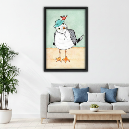 Seagull with crab hat watercolor canvas wall art – black frame styled above rustic desk in home office