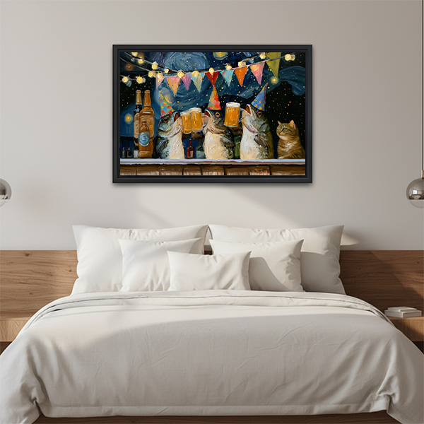 Black-framed cats drinking beer canvas wall art with festive lights displayed above a bed with white pillows.