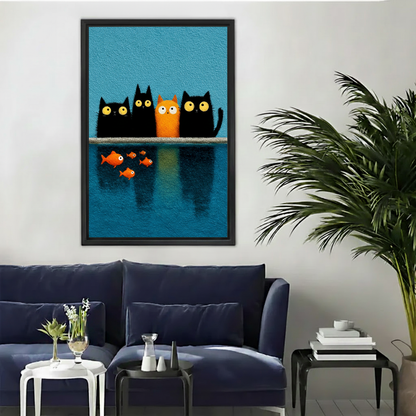 Framed cats watching fish canvas wall art with blue and orange colors above a living room sofa.