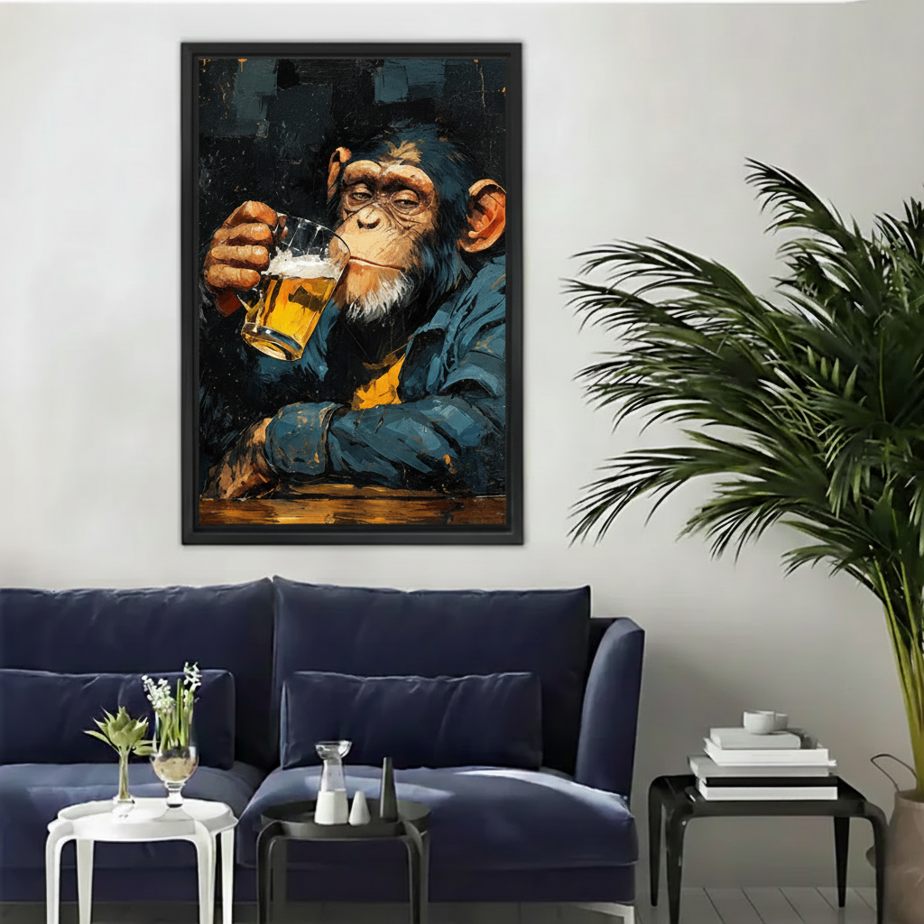 Framed chimpanzee beer canvas wall art displayed above a modern dark blue living room sofa.