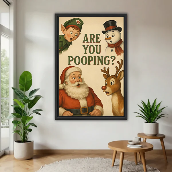 Woman holding framed Christmas bathroom canvas wall art featuring Santa, an elf, snowman, reindeer, and Are You Pooping lettering.