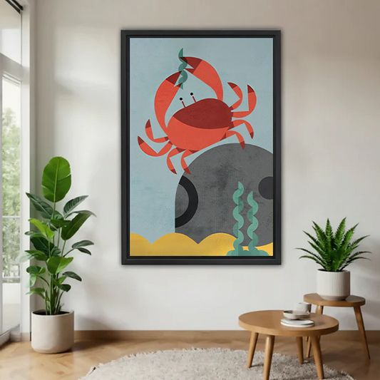 Black-framed coastal crab canvas wall art above a cream sofa with a wooden coffee table and leafy plant.