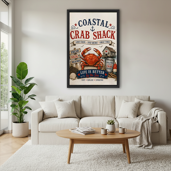 Black-framed coastal crab shack canvas wall art with vintage red and navy typography displayed between leafy plants.