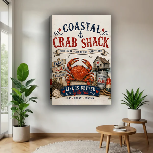 Framed coastal crab shack canvas wall art with a red crab and vintage lettering displayed above a cream sofa.
