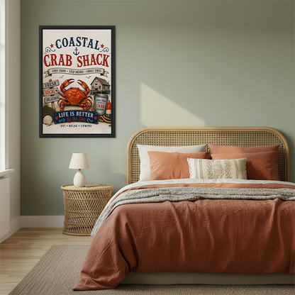 Vintage coastal crab shack canvas wall art in a black frame beside a rattan bed with terracotta bedding.