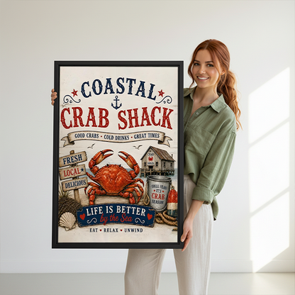 Woman holding black-framed coastal crab shack canvas wall art featuring a red crab, nautical lettering, and seaside details.
